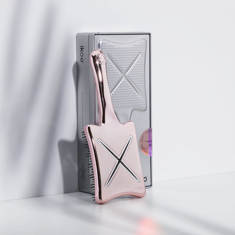 Ideal zum Mitnehmen: die Paddle X Pops Small Stylingbürste in rosa